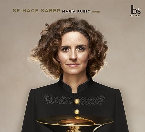Portrait of María Rubio, a woman with curly hair, and a French horn.