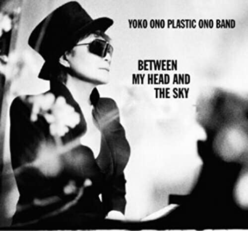 Yoko Ono in a hat and sunglasses, album cover for "Between My Head & The Sky".