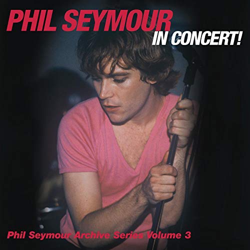 Album cover featuring Phil Seymour holding a microphone, wearing a pink shirt.