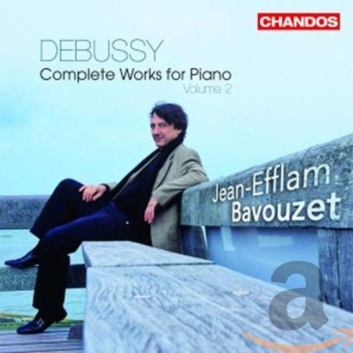 CD cover featuring pianist Jean-Efflam Bavouzet sitting on a stone wall.