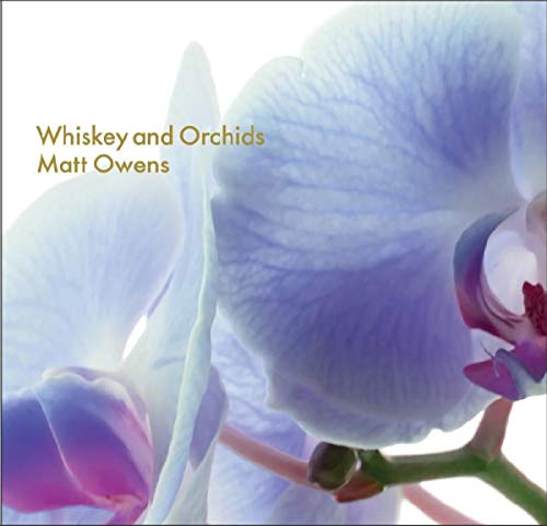 CD cover: close-up of white and purple orchids, blurred background.