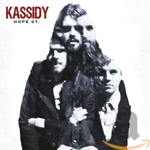 Black and white photo of three men on a record album cover.