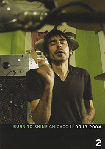 DVD cover featuring a man with a hat singing into a microphone.