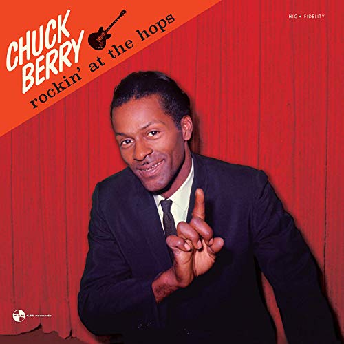 Chuck Berry album cover featuring a man in a suit against a red wall.