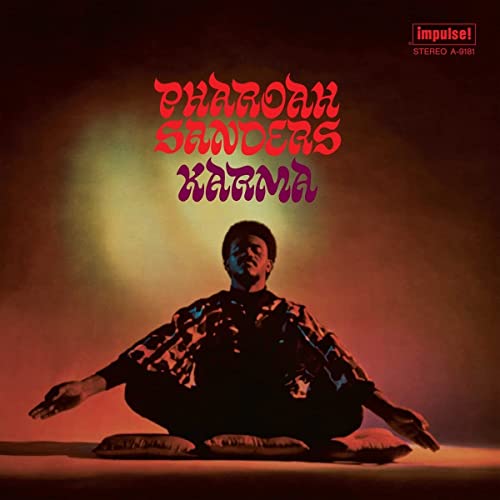 Pharoah Sanders’ “Karma” vinyl album cover featuring a seated musician.
