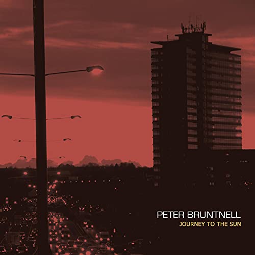 Red sky over city buildings, album cover for Peter Bruntnell.