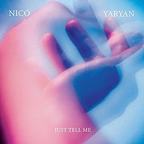 Album cover for Nico Yaryan’s “Just Tell Me” featuring blurred hands.
