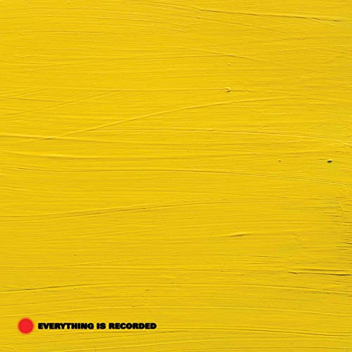 Yellow textured album cover with red dot and black text.