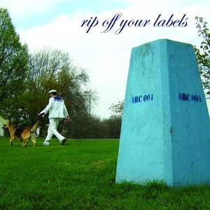 Man walking a dog past a tall, blue concrete pillar in a park.