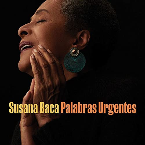 Close-up of Susana Baca with hands pressed to face, album title below.