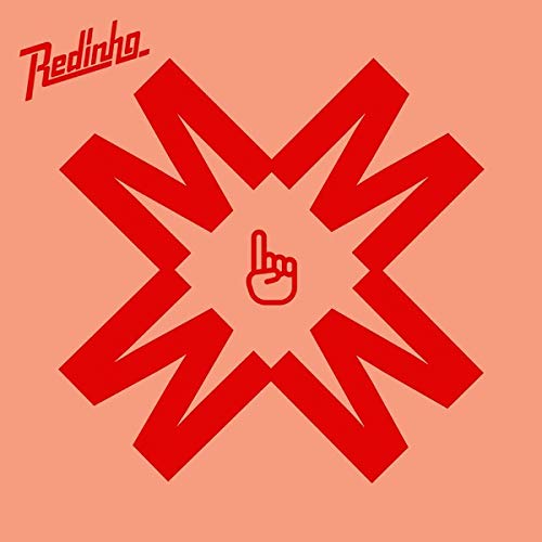 The image is a salmon-colored album cover with a red asterisk and hand symbol.