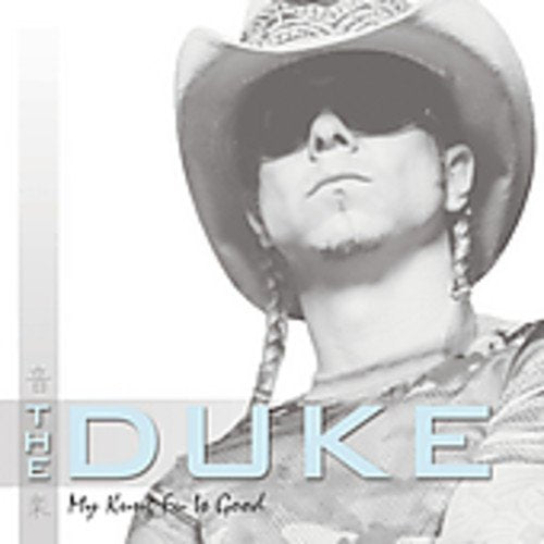Black and white portrait of a man in a cowboy hat and sunglasses.