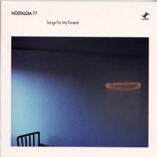 Album cover with a blue-toned photo of a chair and glowing light.