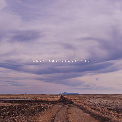 Album cover with a cloudy sky over a dirt road landscape.