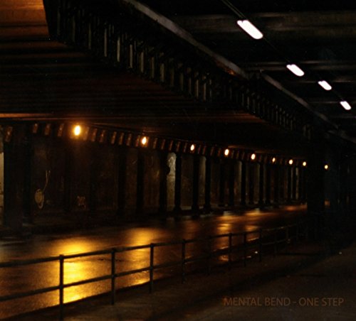 "Dimly lit, industrial space with metal railings and overhead lighting, featuring 'Mental Bend - One Step'."