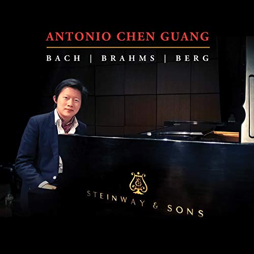 "CD cover featuring a man sitting at a piano, with text and logo."