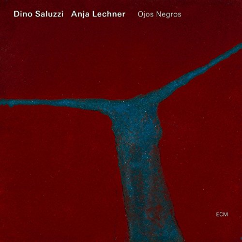 "Red album cover with blue abstract shape and white artist names."