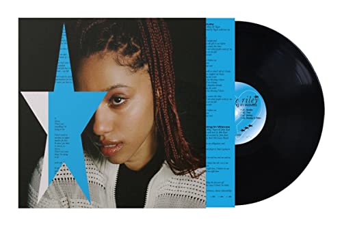 Vinyl record and album cover featuring a portrait of a woman with braided hair.