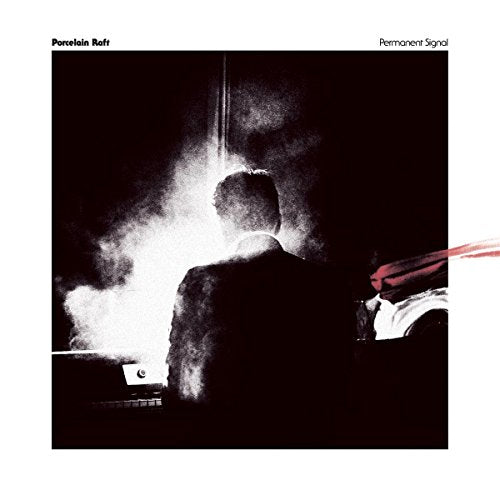 Dark album cover featuring a person at a piano with blurred, bright light.