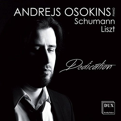Black-and-white album cover featuring a man in a suit against a dark background.