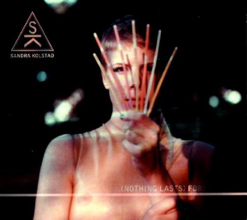 "Album cover with a shirtless woman holding drumsticks in front of her face."