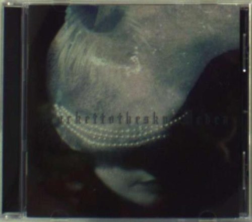 CD case with a close-up image of a mouth with beaded lips.