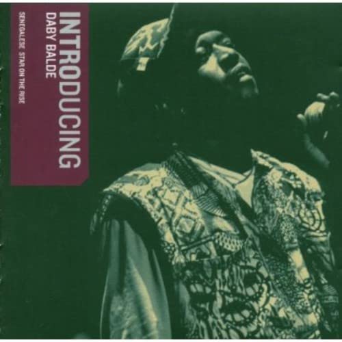 CD cover featuring Daby Balde in patterned clothing, looking to the side.