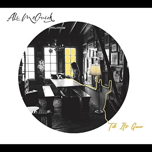 Vinyl record cover: interior room scene with a lone figure at a table.