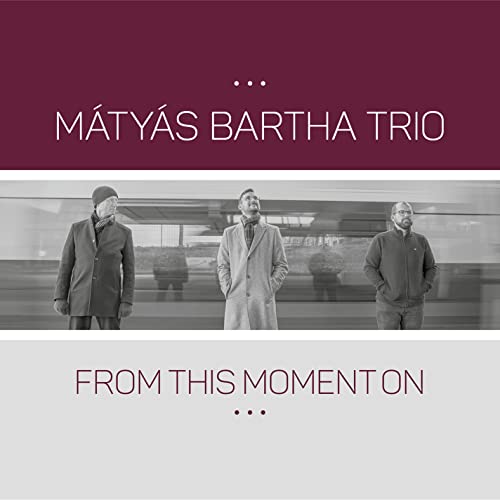 CD cover: Matyas Bartha Trio, three men in coats, blurred background.