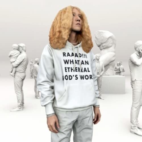 Person with curly hair in a museum, wearing a text-covered hoodie.