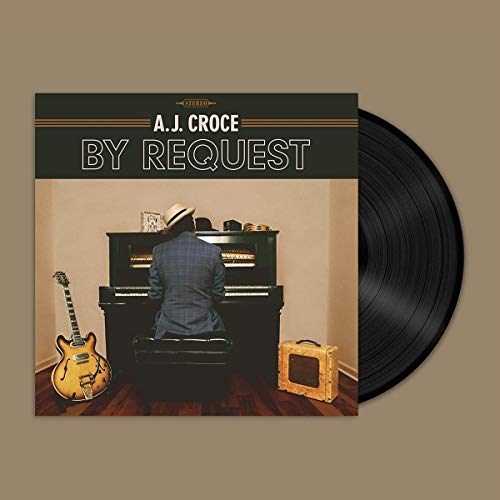 Vinyl record cover featuring a man in a hat sitting at a piano.