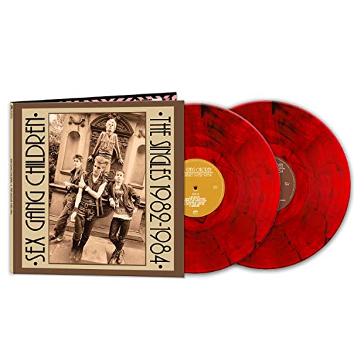Red vinyl record set with cover featuring a black and white band photo.