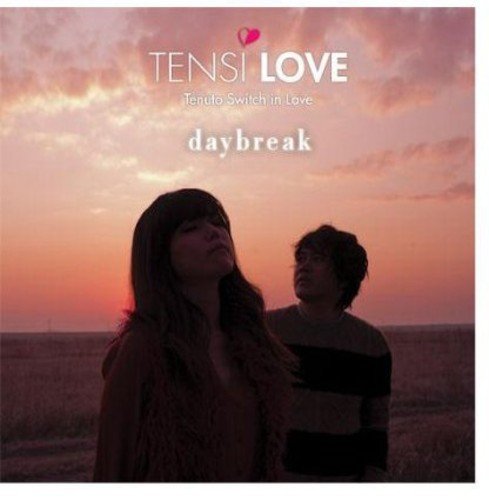CD cover featuring a man and woman silhouetted against a sunset sky.