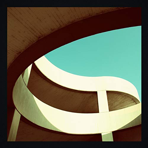 A CD case cover featuring an abstract, curved architectural design with teal and cream colors.