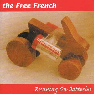 "Album cover with wooden toy car and battery, red banner with white text."