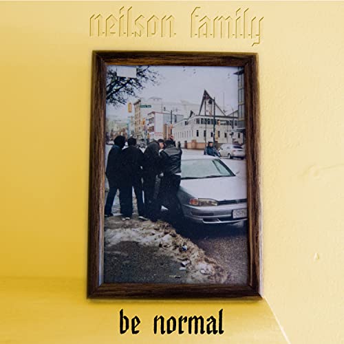 CD cover: framed black and white photo of people near a car.