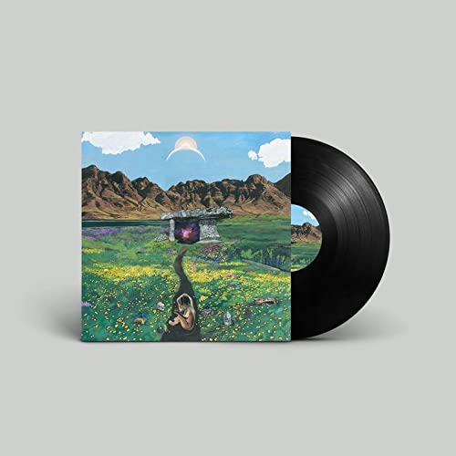 Vinyl record with cover art depicting a landscape and abstract figures.