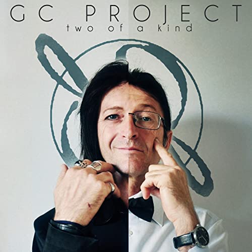 CD cover featuring a portrait of a man with glasses and rings.