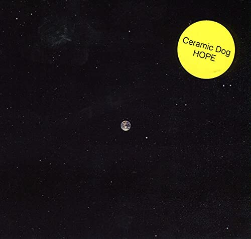 Black background with a yellow circle and small planet image.