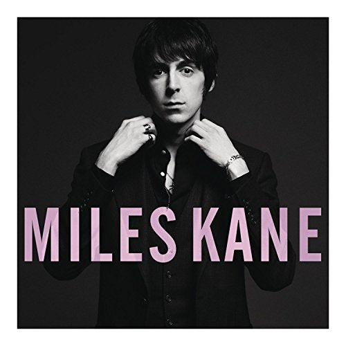 Black and white portrait of Miles Kane with pink text overlay.