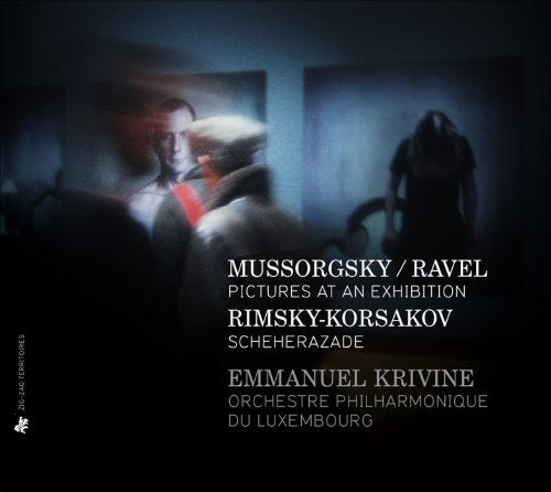 "CD cover with blurry figures and white text on a dark background."