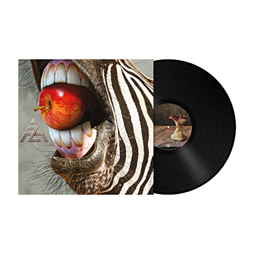 Vinyl record with album art of a zebra’s mouth holding a red apple.