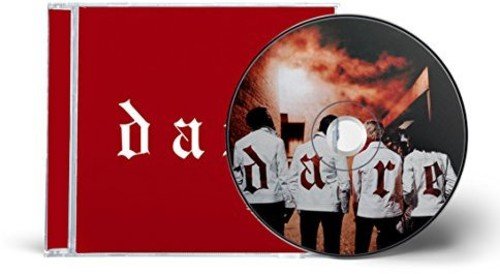 Four men in white jackets with red letters stand in a dark alleyway.