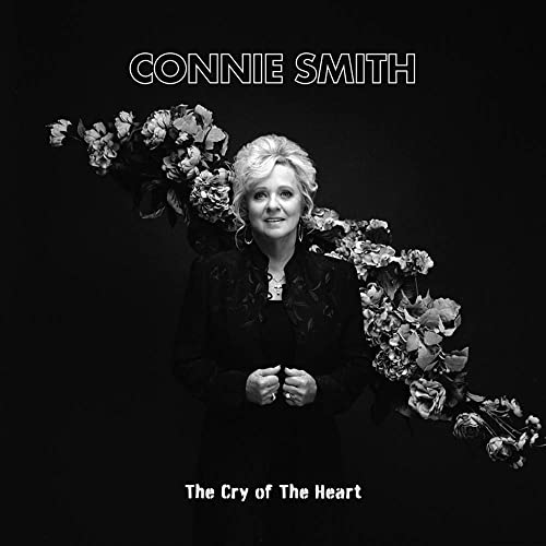 Black and white portrait of Connie Smith with flowers, album cover.