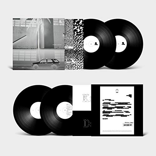 Two black vinyl records with album artwork depicting a car and abstract patterns.