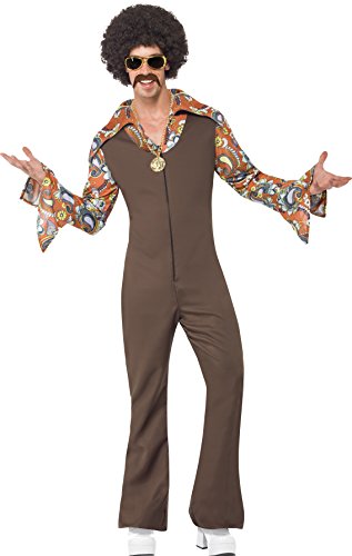 Man wearing a brown jumpsuit with patterned sleeves, afro wig, sunglasses, and white shoes.