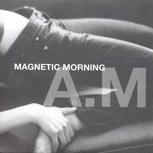 Black and white CD cover with large "A.M." letters and a person.