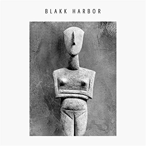 CD cover: grayscale image of a stone sculpture of a figure.