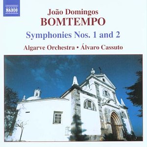 CD cover featuring a white stone church against a blue sky.