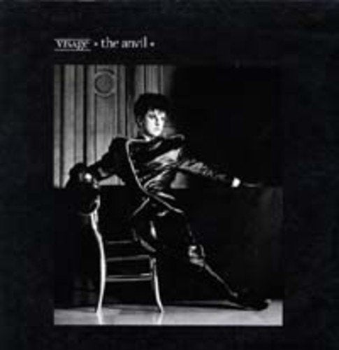 "Album cover with a man sitting in a chair, black and white image."
